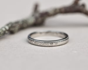 Image of  Platinum 3mm,  Latin engraved milled edge ring