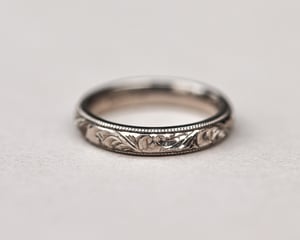 Image of 18ct White gold, 4mm Floral and milled edge engraved ring