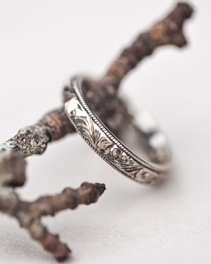 Image of 18ct White gold, 4mm Floral and milled edge engraved ring