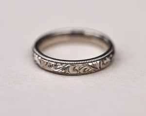 Image of 18ct White gold, 4mm Floral and milled edge engraved ring