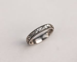 Image of 18ct White gold, 4mm Floral and milled edge engraved ring