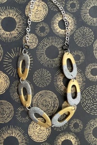 Gold and paper collaged oval wooden pieced necklace No. 2