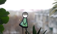Image 1 of Girl with flower. Figurine for a flower pot