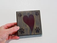 Image 3 of One wooden dog lover coaster with paw prints and a carved heart filled with red epoxy