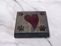 Image 5 of One wooden dog lover coaster with paw prints and a carved heart filled with red epoxy