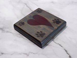 Image of One wooden dog lover coaster with paw prints and a carved heart filled with red epoxy