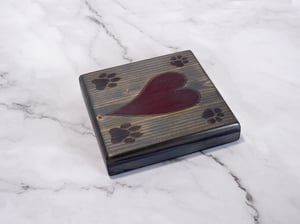 Image of One wooden dog lover coaster with paw prints and a carved heart filled with red epoxy