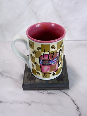 Image of One wooden dog lover coaster with paw prints and a carved heart filled with red epoxy