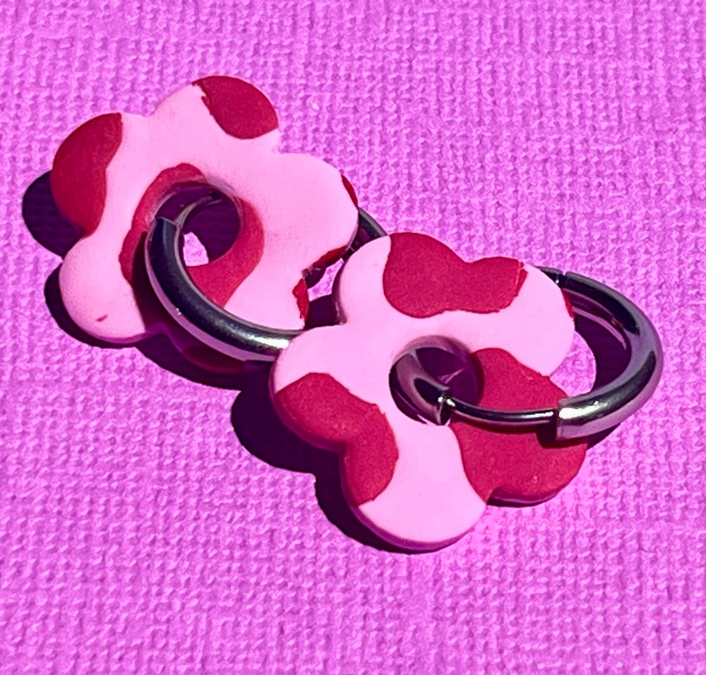 Image of Pink Cowprint Flower Hoops