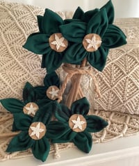 Image 1 of Memory Flowers custom created from a clients loved ones precious hockey polos