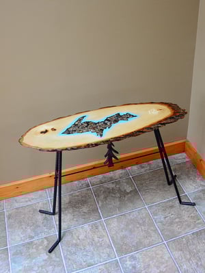 Image of Handmande Life Edge Bass Wood Table Upper Peninsula of Michigan filled with river pebbles, epoxy