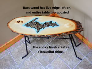Image of Handmande Life Edge Bass Wood Table Upper Peninsula of Michigan filled with river pebbles, epoxy