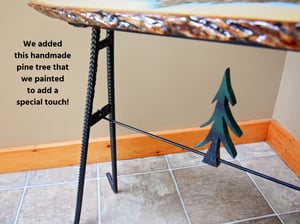 Image of Handmande Life Edge Bass Wood Table Upper Peninsula of Michigan filled with river pebbles, epoxy