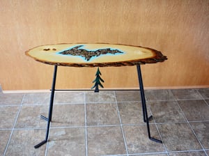 Image of Handmande Live Edge Bass Wood Table Upper Peninsula of Michigan filled with river pebbles, epoxy