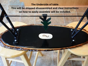 Image of Handmande Live Edge Bass Wood Table Upper Peninsula of Michigan filled with river pebbles, epoxy