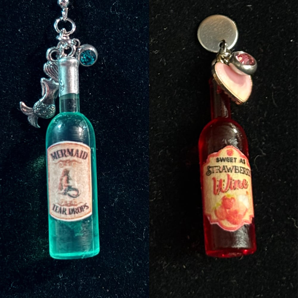 Image of Wine bottles mermaid tears, strawberry wine 