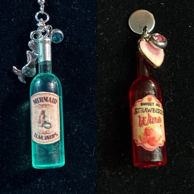 Image of Wine bottles mermaid tears, strawberry wine 
