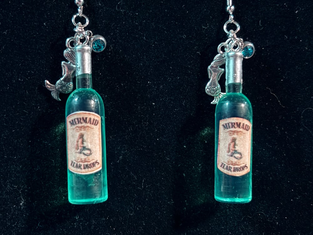 Image of Wine bottles mermaid tears, strawberry wine 