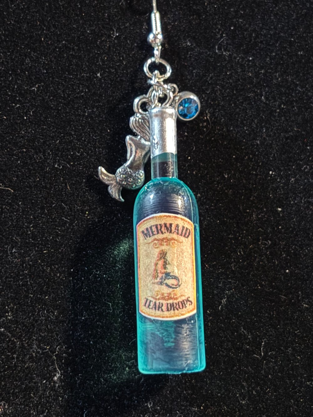 Image of Wine bottles mermaid tears, strawberry wine 
