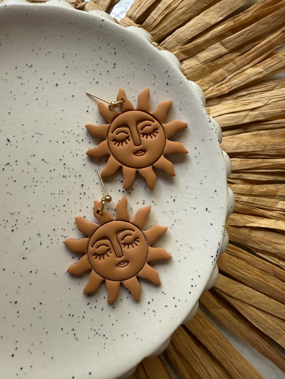 Image of rusty sun dangles