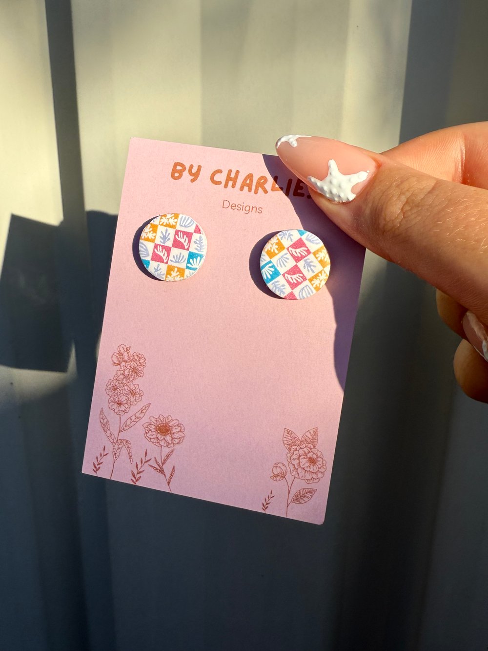 Image of coral print round studs