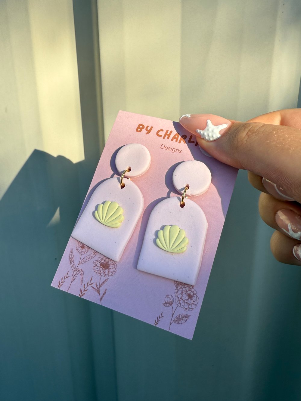 Image of baby pink & yellow clam dangles
