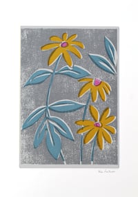 Yellow Rudbeckia - blue leaves and textured ground