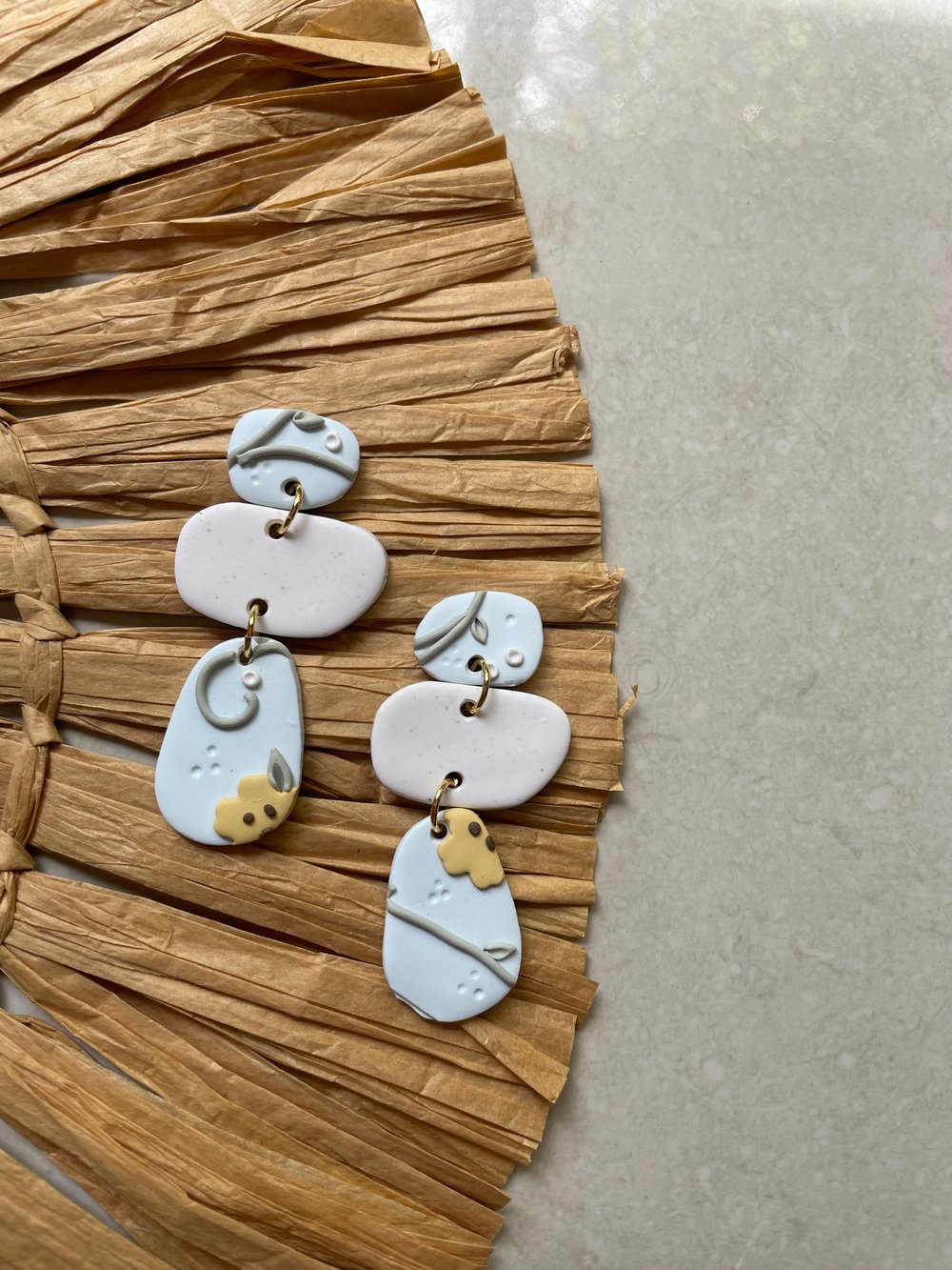 Image of baby blue floral orangic dangles