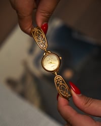 Image 1 of Gold Anne Klein floral watch