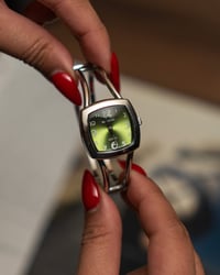 Image 1 of 90s vintage emerald green watch