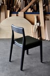 ROSE DINING CHAIR IN TORCHED TASMANIAN OAK WITH AN UPHOLSTERED LEATHER SEAT