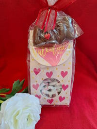 Valentine box filled with seasonally decorated and dipped pretzels