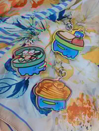 Image 1 of 'Tad Cafe Holographic Acrylic Keychain
