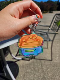 Image 2 of 'Tad Cafe Holographic Acrylic Keychain