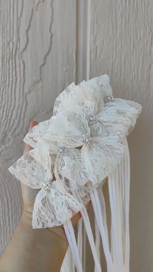 Image of Off white lace bows