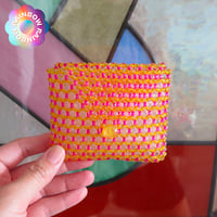 Image 1 of pink and yellow purse