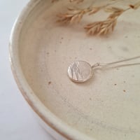 Textured weighted wave pendent 