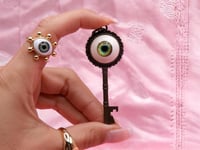 Image 1 of Key pendant with eye, from ALICE in Wonderland