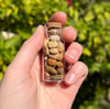 Altered Pebbles: Honey vial