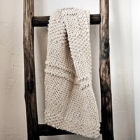 Image 5 of Amber hand knit cotton towel, made with recycled Argentinian cotton yarn. Handy corner loop to hang