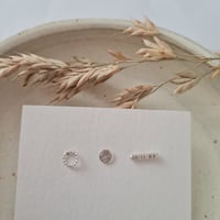 Trio of textured studs 