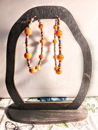 Image 6 of Daisy Orange, Ocean Blue, Red, and Gold Multicolor Beaded Extra Large Hoop Earrings