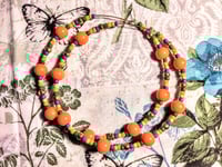 Image 9 of Daisy Orange, Leaf Green, Purple, and Copper Multicolor Beaded Extra Large Hoop Earrings