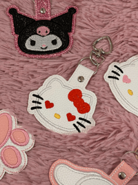 Image 1 of red hello kitty keychain