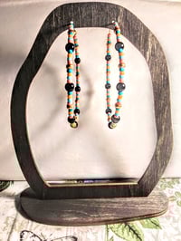 Image 6 of Petunia Black, Sky Blue, Ocean Blue, Orange, and Gold Multicolor Beaded Extra Large Hoop Earrings
