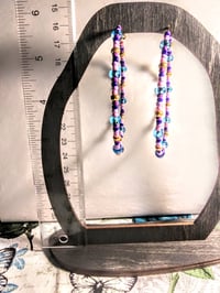 Image 5 of Sky Blue, Carnation Pink, Lavender, Dark Blue, and Gold Multicolor Beaded Extra Large Hoop Earrings