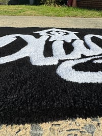 Image 2 of The Plug Rug 