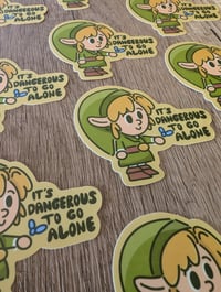 Image 3 of It's Dangerous to go Alone - Vinyl Laminate Sticker