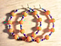 Image 1 of Daisy Orange, Sapphire Blue, Ocean Blue, and Red Multicolor Beaded Medium Hoop Earrings