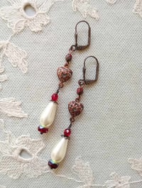 Image 4 of Renaissance copper filigree hearts long earrings handmade with red faceted & ivory glass pearl beads
